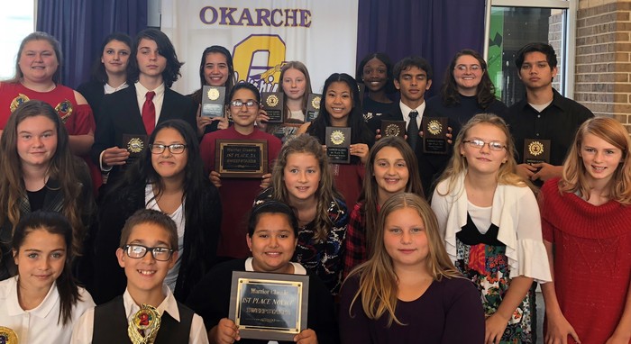 Speech team with trophies